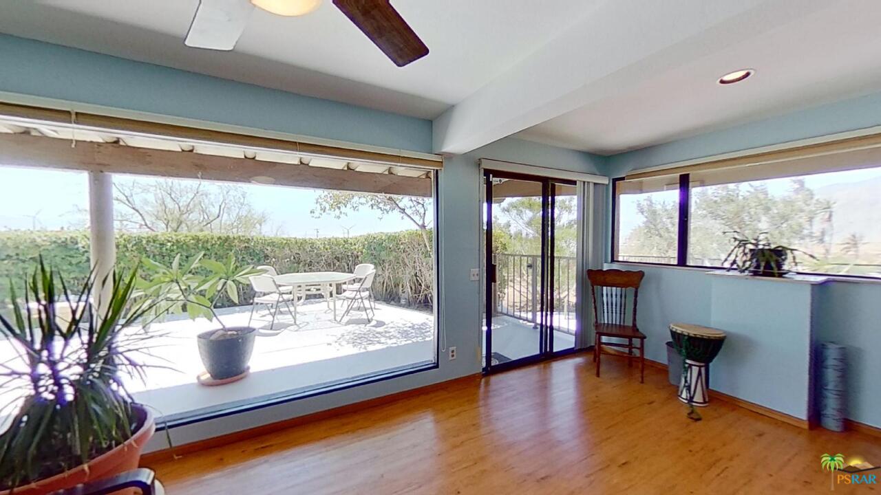 61612 Sagebrush Road North Palm Springs, CA 92258 - Photo 16 of 30 a room with furniture and a large window