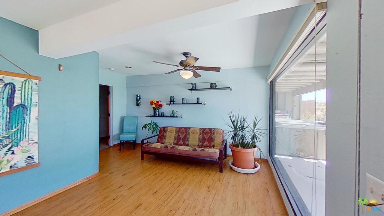 61612 Sagebrush Road North Palm Springs, CA 92258 - Photo 17 of 30 a living room with furniture and a potted plant
