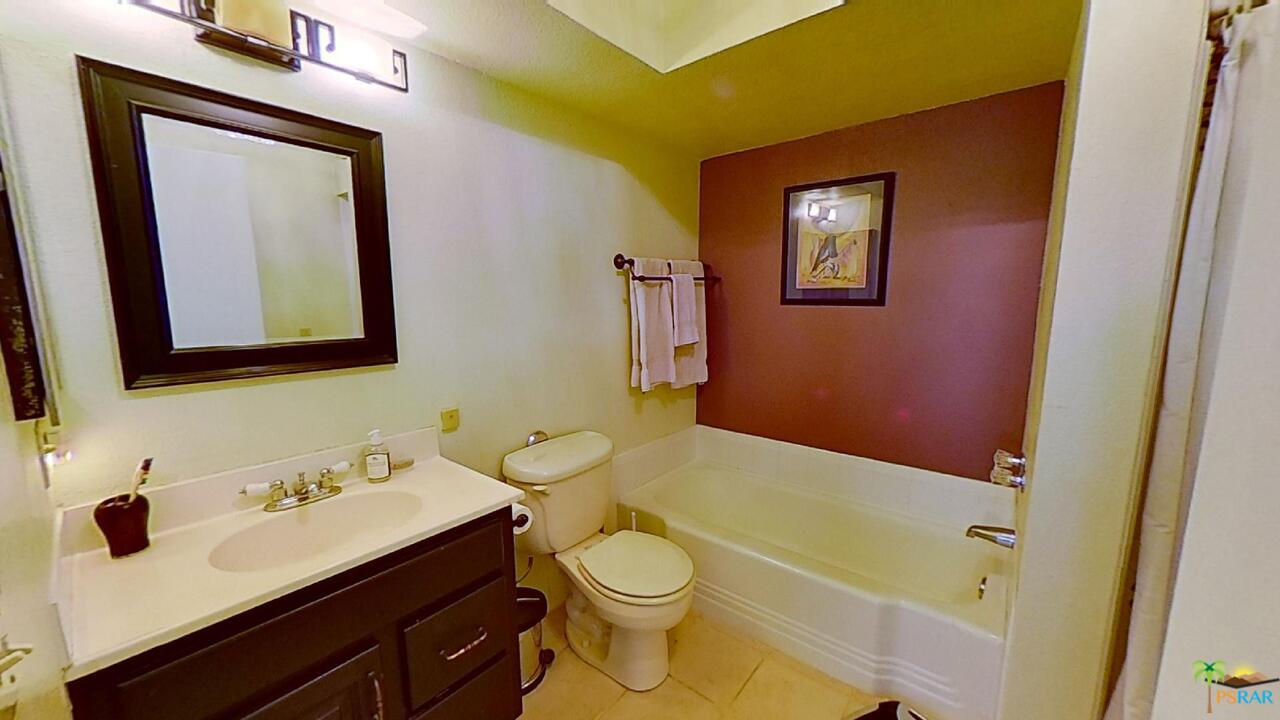 61612 Sagebrush Road North Palm Springs, CA 92258 - Photo 18 of 30 a bathroom with a sink a toilet and shower