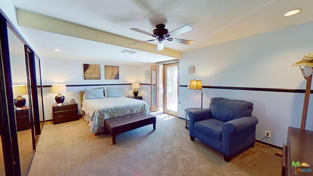 61612 Sagebrush Road North Palm Springs, CA 92258 - Photo 19 of 30 a bedroom with furniture and a couch