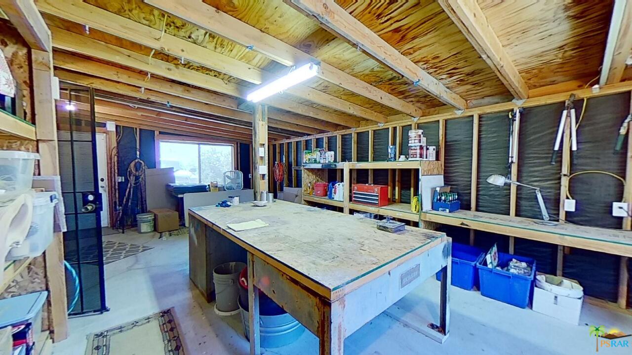 61612 Sagebrush Road North Palm Springs, CA 92258 - Photo 22 of 30 a view of kitchen with furniture and a fireplace