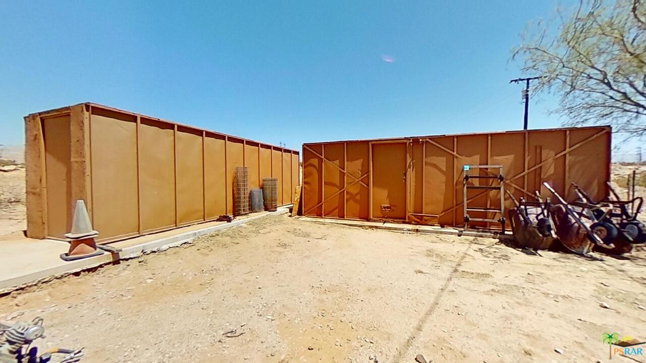 61612 Sagebrush Road North Palm Springs, CA 92258 - Photo 26 of 30 a view of a backyard with wooden fence