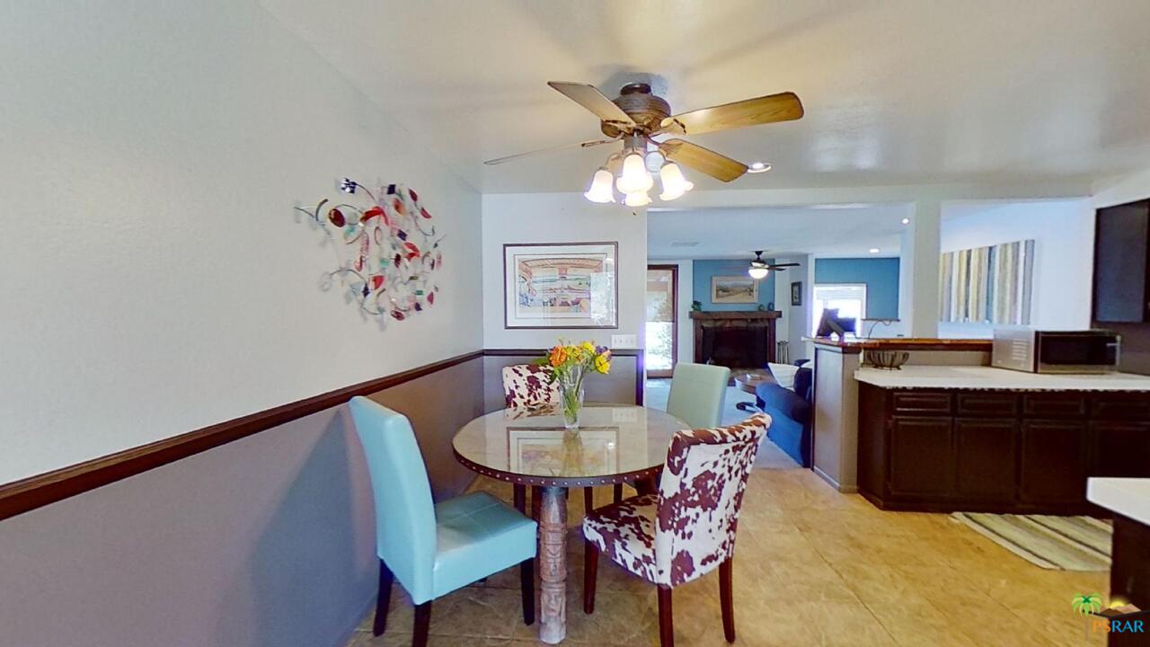 61612 Sagebrush Road North Palm Springs, CA 92258 - Photo 9 of 30 a dining room with furniture and window