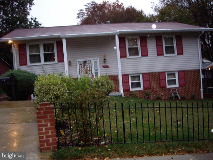 4412 Havelock Road Lanham, MD 20706 - Photo 1 of 11 a front view of a house with a garden