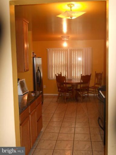 4412 Havelock Road Lanham, MD 20706 - Photo 2 of 11 a view of a hall with dining area and furniture