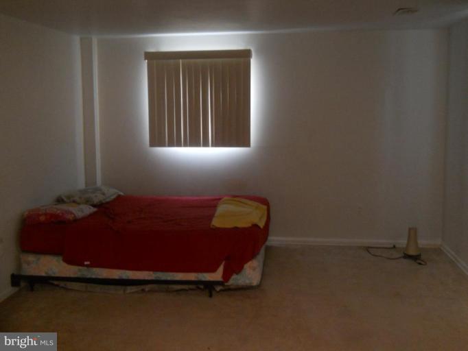 4412 Havelock Road Lanham, MD 20706 - Photo 10 of 11 a room with a bed