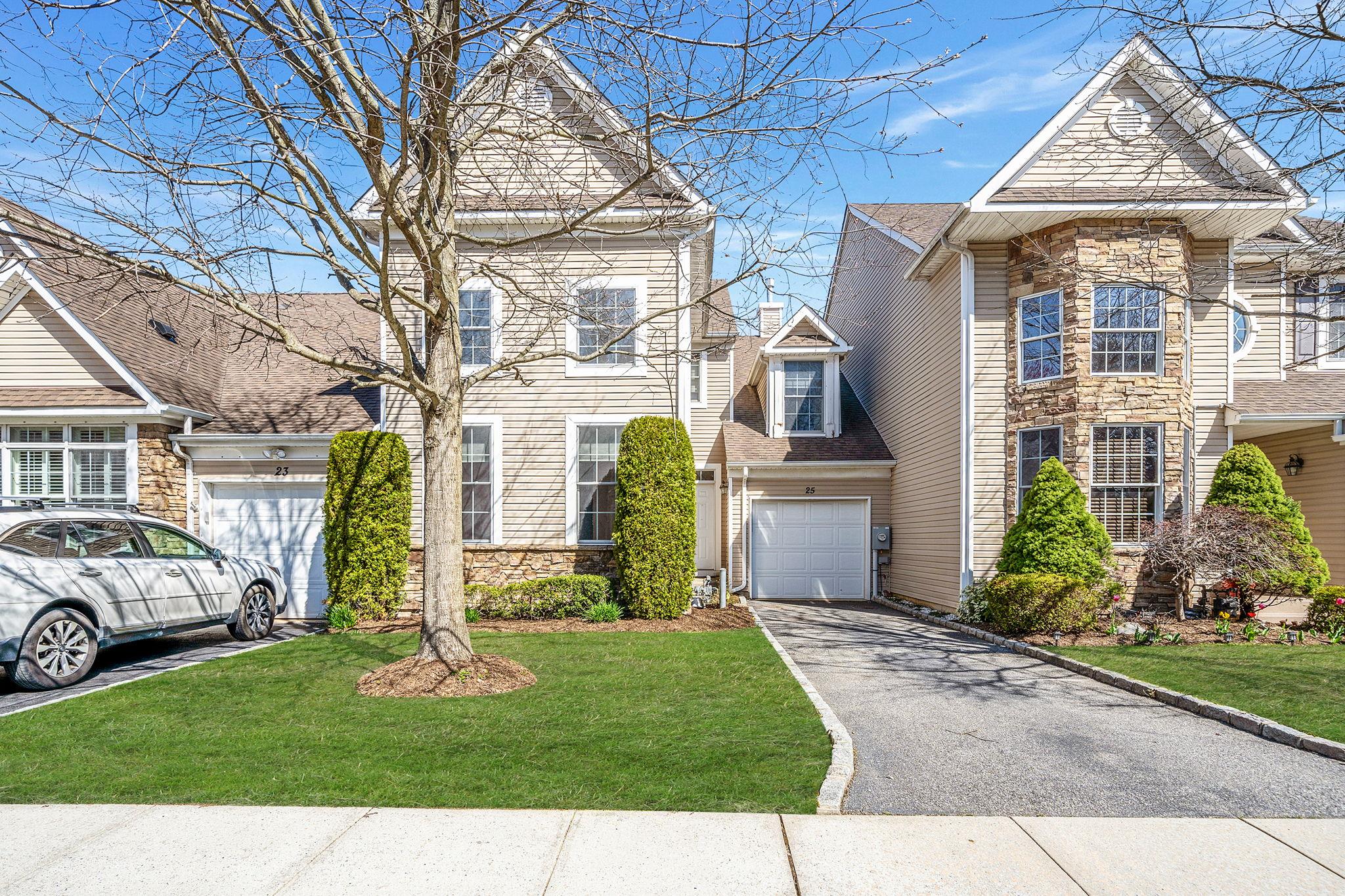 25 Eagle Circle Bohemia, NY 11716 - Photo 1 of 1 a front view of a house with a yard