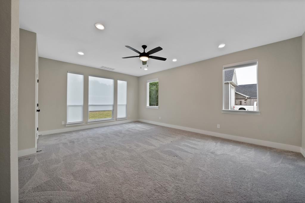 2223 Providence Way Nevada, TX 75173 - Photo 38 of 40 an empty room with windows and ceiling fan
