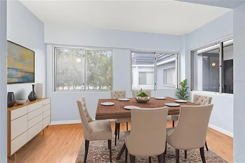 a view of a dining room with furniture window and outside view