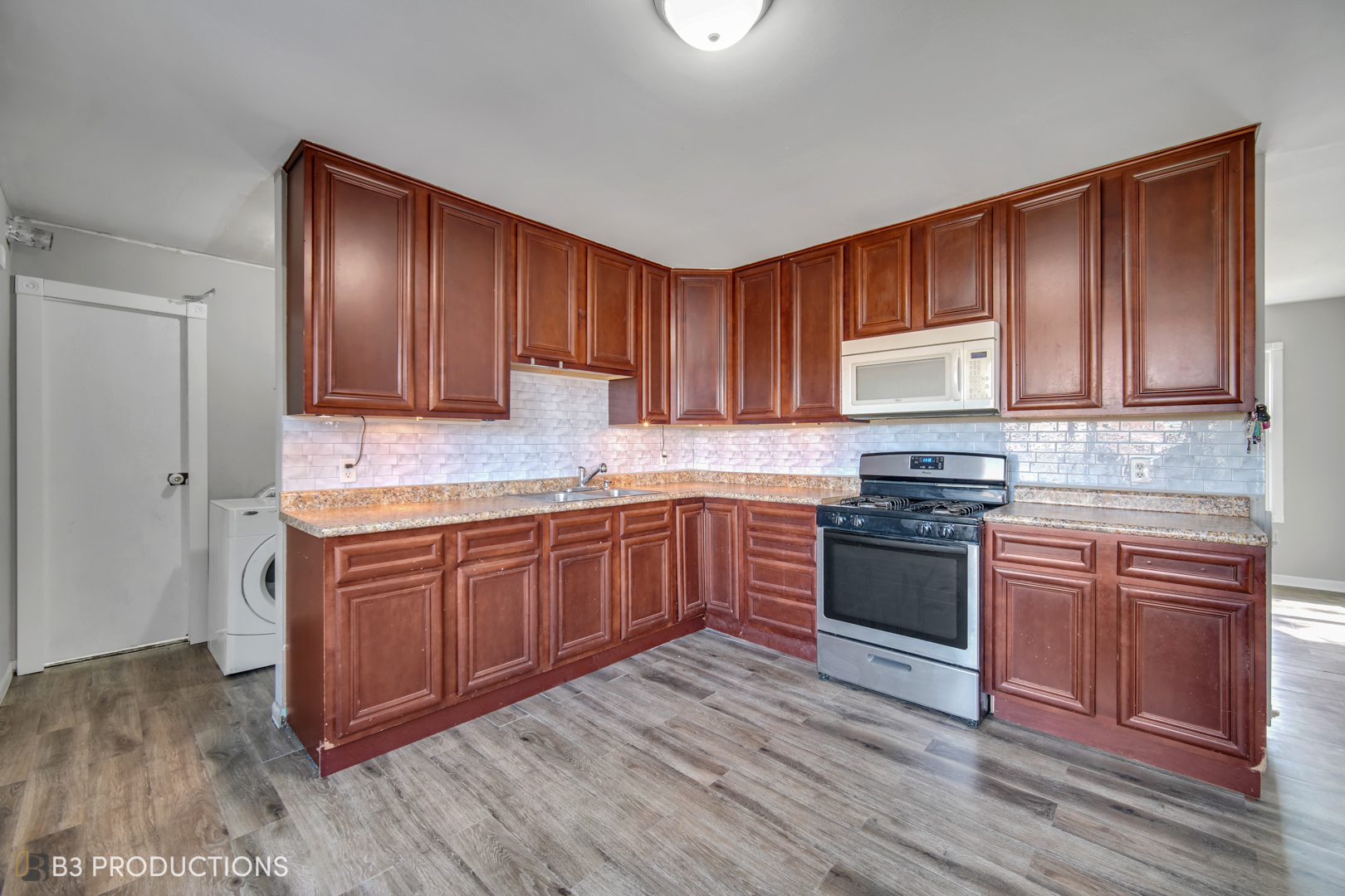 22 Arlington Drive Romeoville, IL 60446 - Photo 2 of 15 a kitchen with stainless steel appliances granite countertop a stove a sink dishwasher and a refrigerator