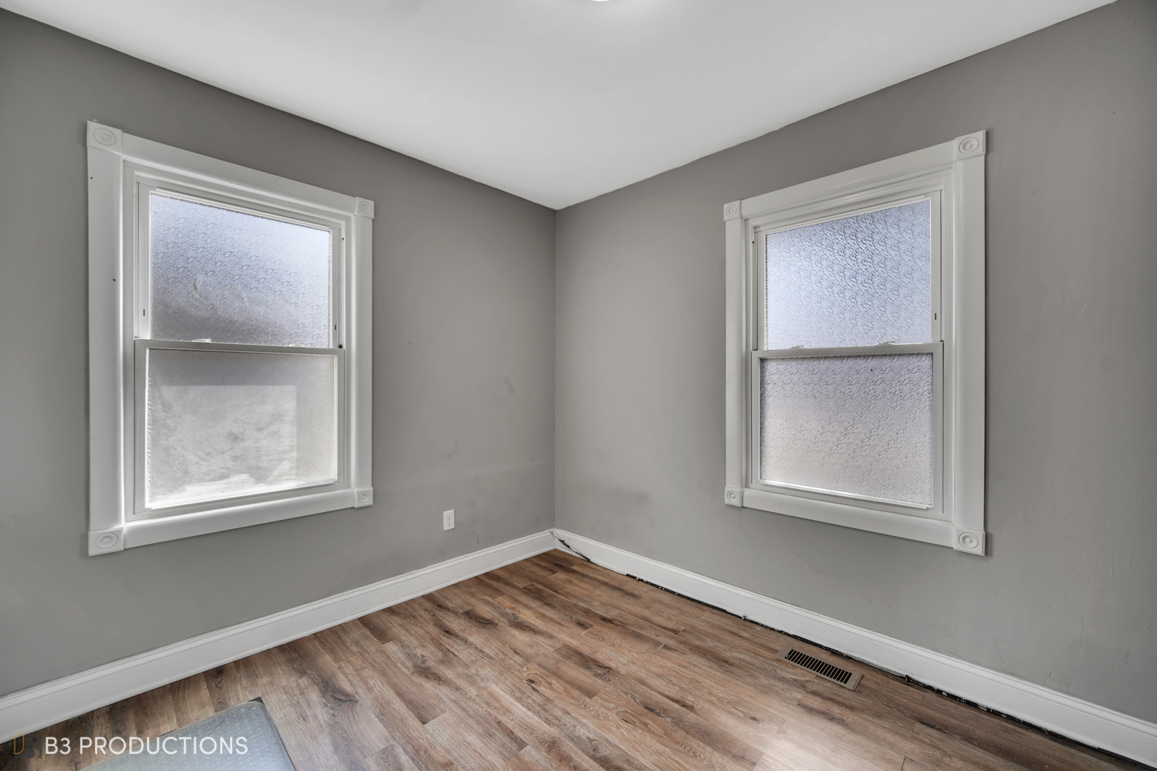 22 Arlington Drive Romeoville, IL 60446 - Photo 11 of 15 a view of an empty room with wooden floor and a window