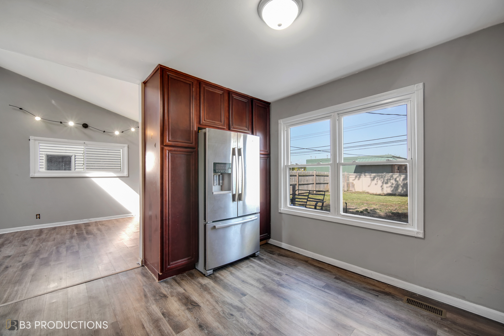 22 Arlington Drive Romeoville, IL 60446 - Photo 5 of 15 a view of an empty room with a window and wooden floor