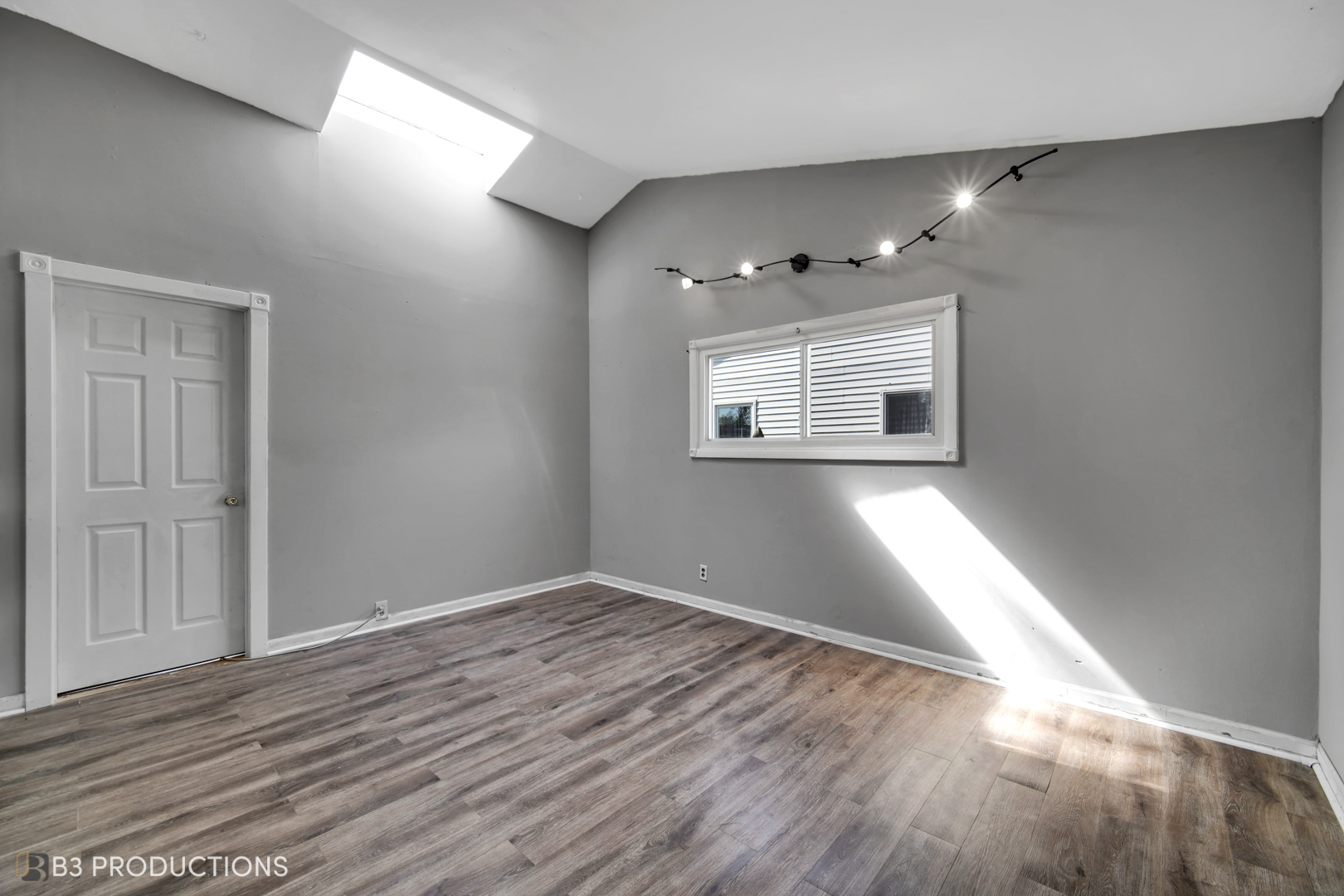 22 Arlington Drive Romeoville, IL 60446 - Photo 6 of 15 wooden floor in an empty room with a window