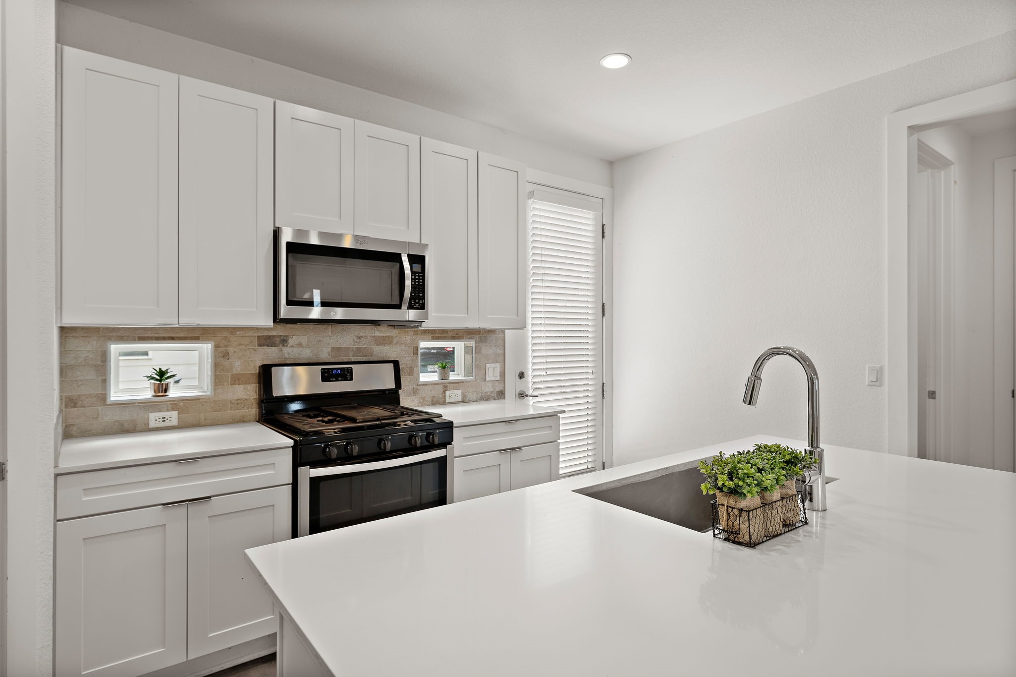6404 Porter Street, Unit 1 Austin, TX 78741 - Photo 2 of 22 The kitchen includes a gas range and tons of cabinet storage.