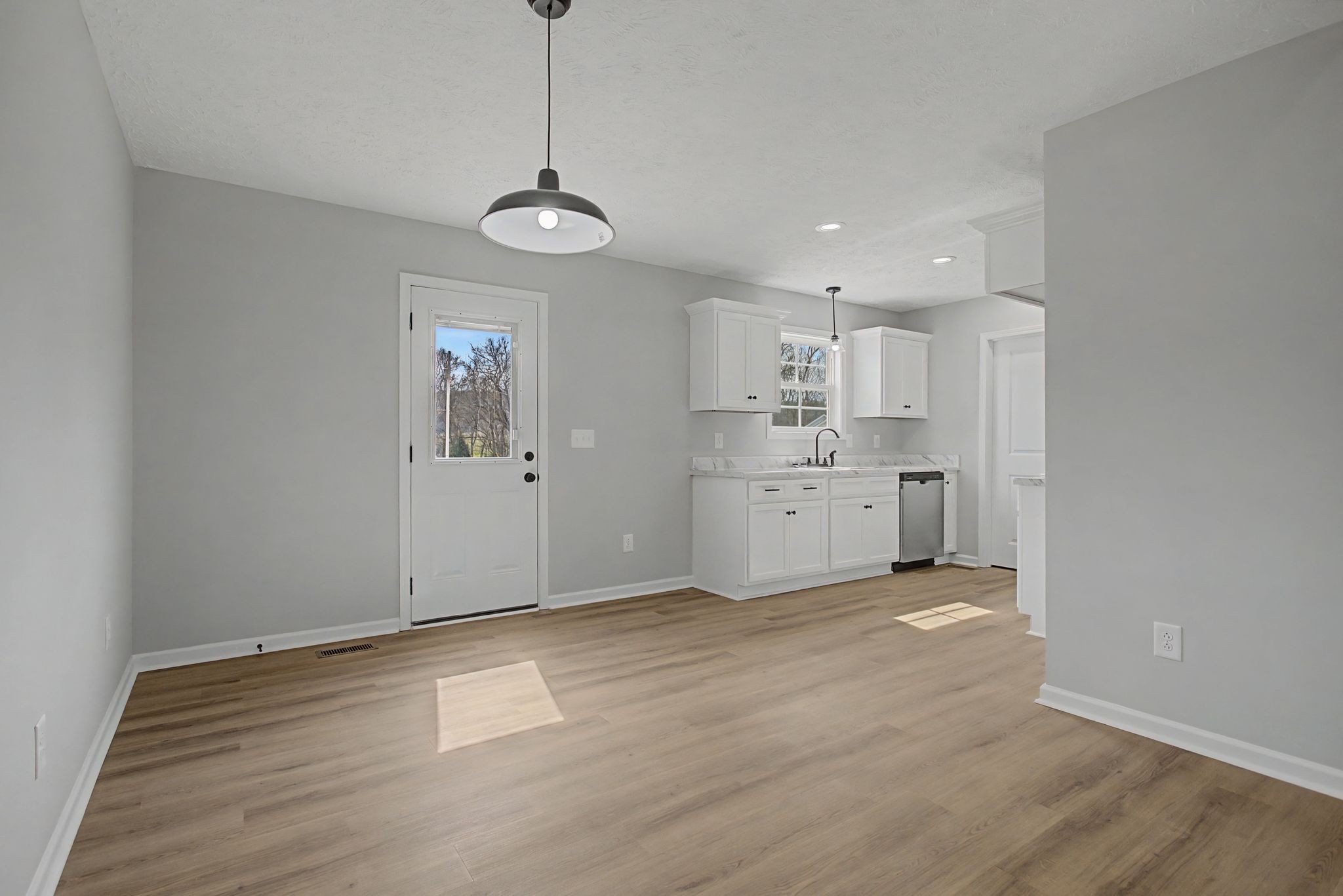 2333 Claude Fox Road Cornersville, TN 37047 - Photo 11 of 24 a view of a kitchen with a sink cabinets and wooden floor