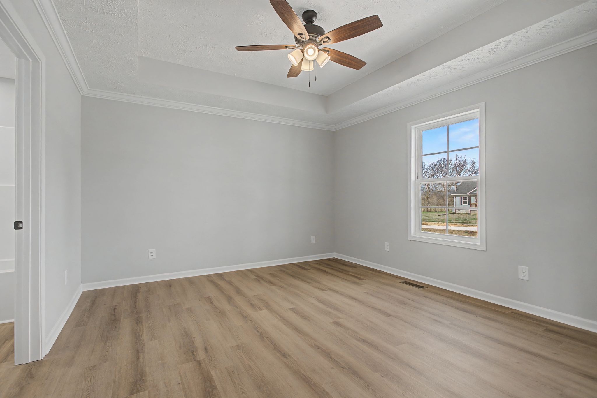2333 Claude Fox Road Cornersville, TN 37047 - Photo 14 of 24 an empty room with a window and a fan