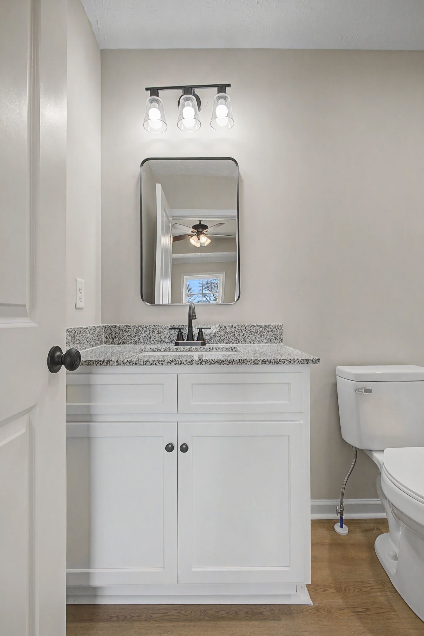 2333 Claude Fox Road Cornersville, TN 37047 - Photo 17 of 24 a bathroom with a toilet sink and mirror