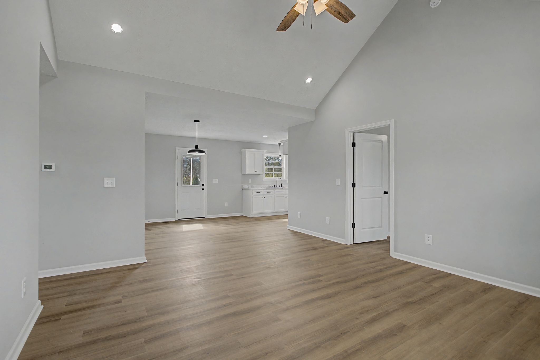 2333 Claude Fox Road Cornersville, TN 37047 - Photo 9 of 24 wooden floor in an empty room with a window