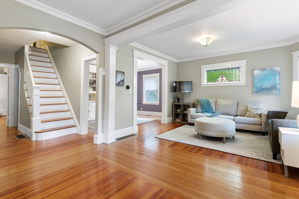 16 Orvis Road, Unit 1 Arlington, MA 02474 - Photo 19 of 31 a living room with furniture and a wooden floor