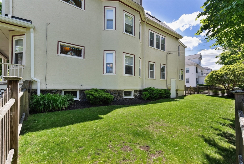 16 Orvis Road, Unit 1 Arlington, MA 02474 - Photo 24 of 31 a front view of a house with a garden