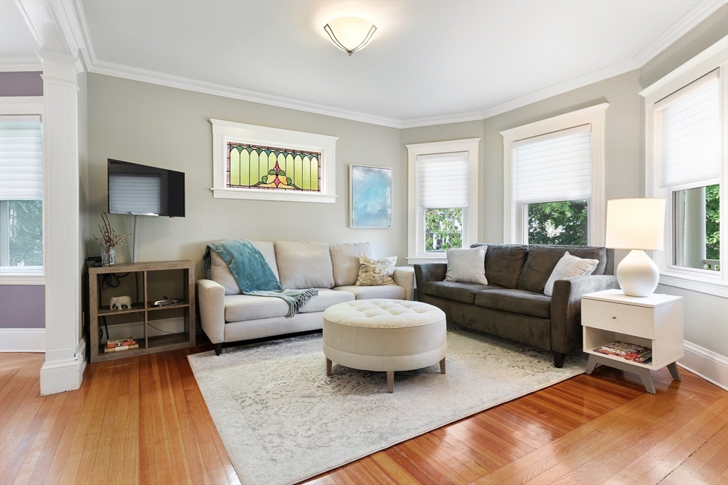 16 Orvis Road, Unit 1 Arlington, MA 02474 - Photo 5 of 31 a living room with furniture and a rug