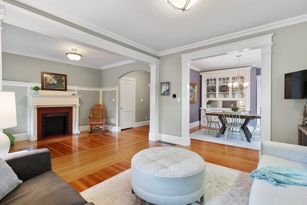 16 Orvis Road, Unit 1 Arlington, MA 02474 - Photo 8 of 31 a living room with furniture and a fireplace