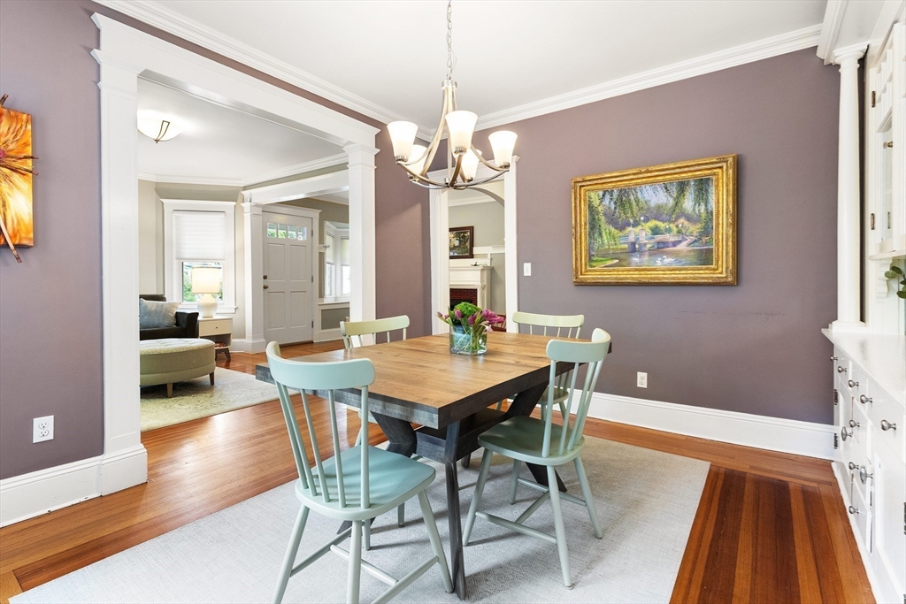 16 Orvis Road, Unit 1 Arlington, MA 02474 - Photo 10 of 31 a view of a dining room with furniture wooden floor and a chandelier