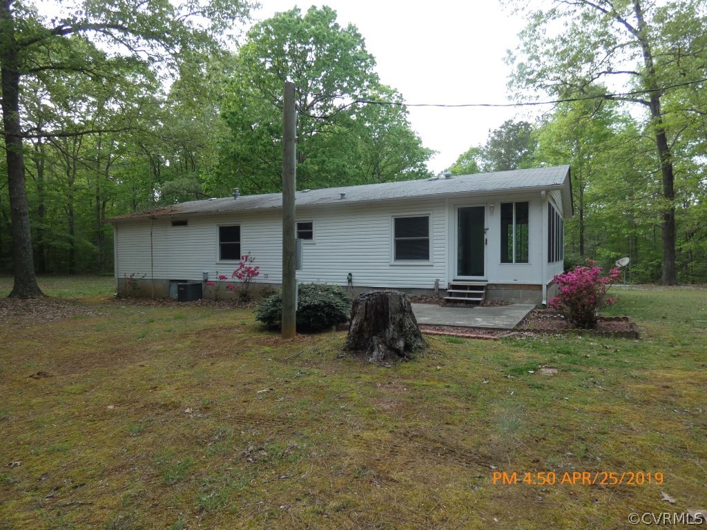 16210 Glebe Road Dewitt, VA 23840 - Photo 9 of 31 a view of a house with backyard and garden