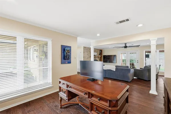 a living room with furniture a table and a window