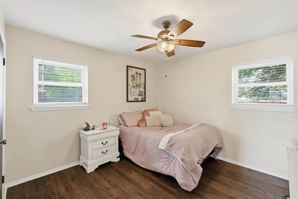 a bed room with a bed and a window