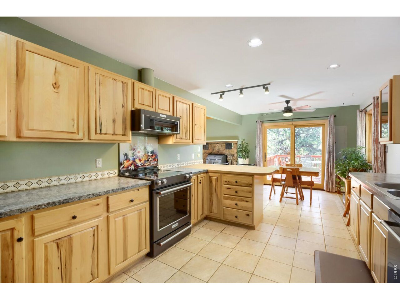 636 Ranch Road Ward, CO 80481 - Photo 5 of 24 A beautifully updated kitchen combines style and functionality, offering ample counter space and a welcoming layout for cooking and entertaining.