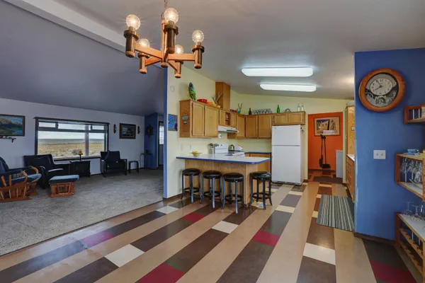 a view of a livingroom with furniture and a table