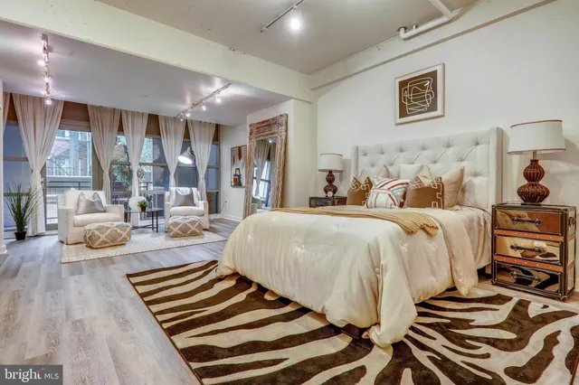 a bed room with a bed and a couch