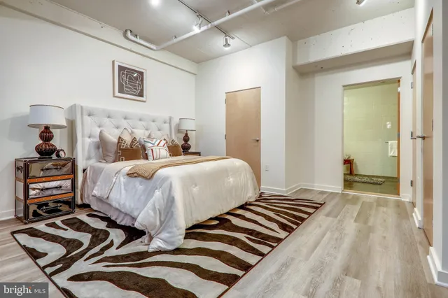 a bedroom with beds and a window