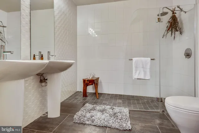 a bathroom with a bathtub sink and toilet
