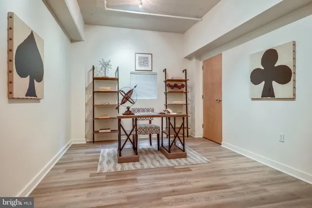 a view of a livingroom with furniture and wooden floor