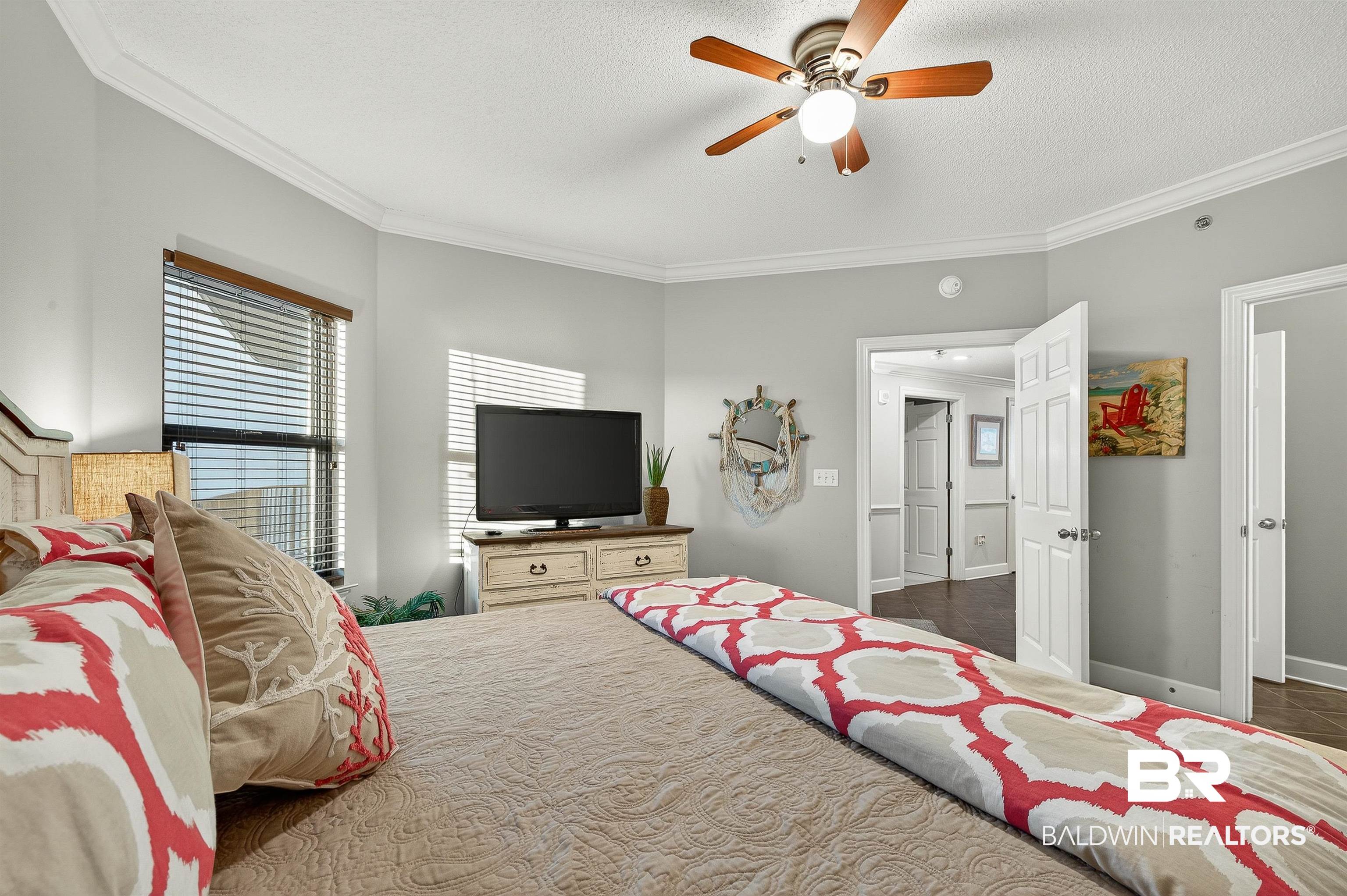 27582 Canal Road, Unit 2507 Orange Beach, AL 36561 - Photo 38 of 75 Bedroom featuring ornamental molding, a textured ceiling, and ceiling fan