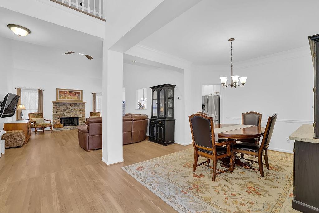 1978 New Kemp Road Marietta, GA 30066 - Photo 6 of 45 a dining room with furniture a chandelier and wooden floor