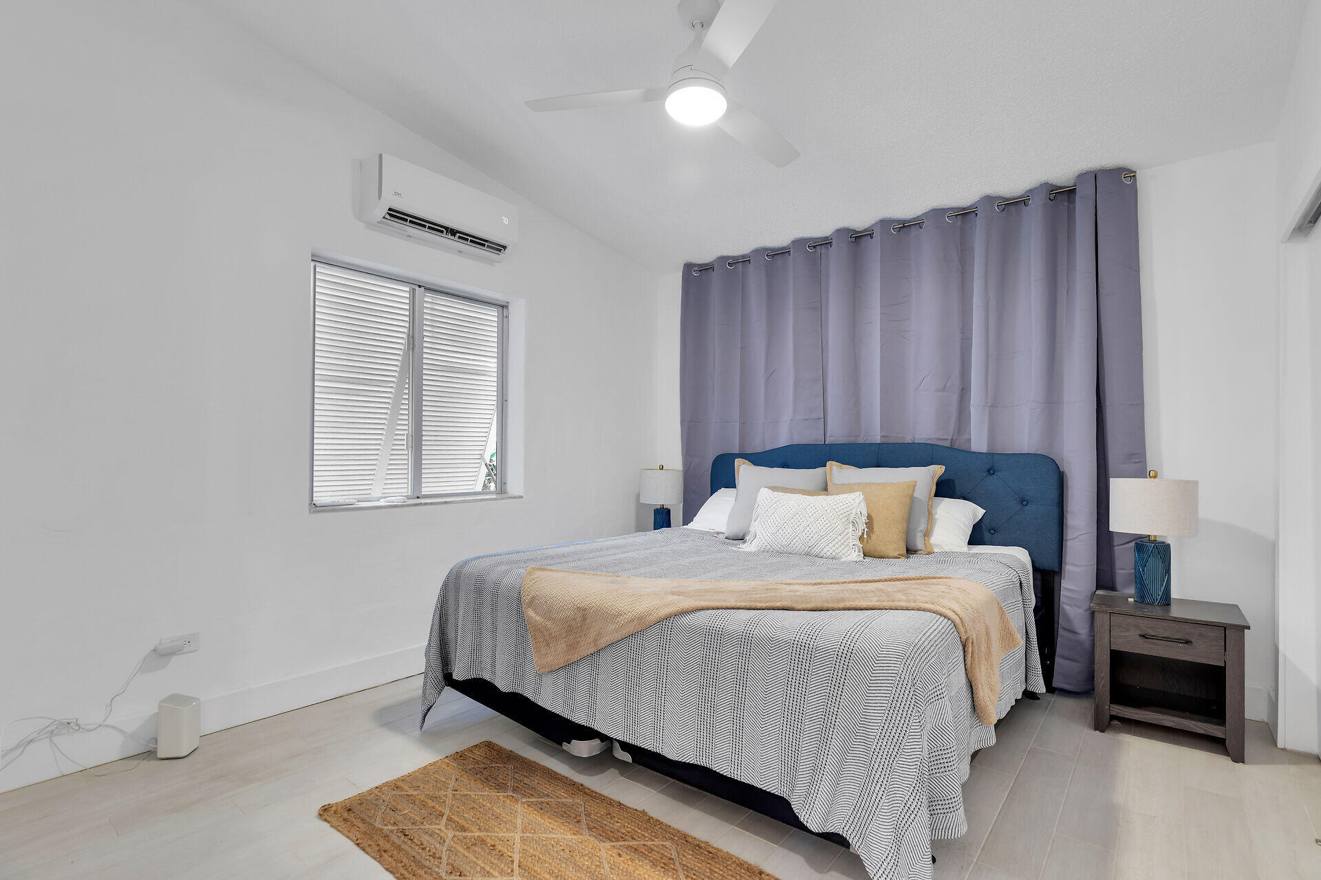 1519 Johnson Street Key West, FL 33040 - Photo 15 of 47 a bedroom with a bed and wooden floor