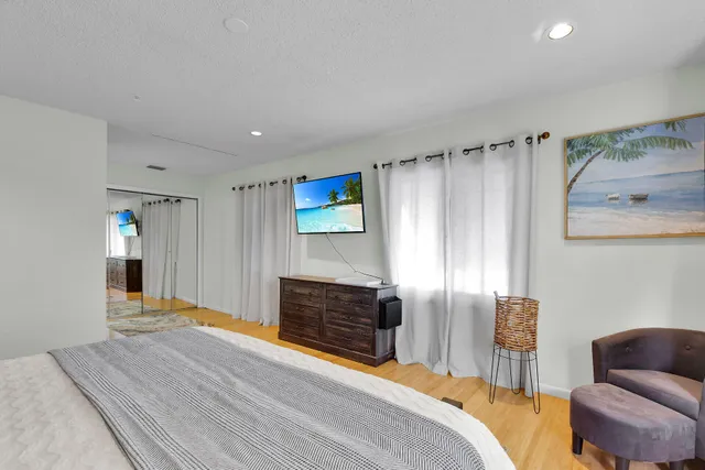 a bedroom with a bed and a couch