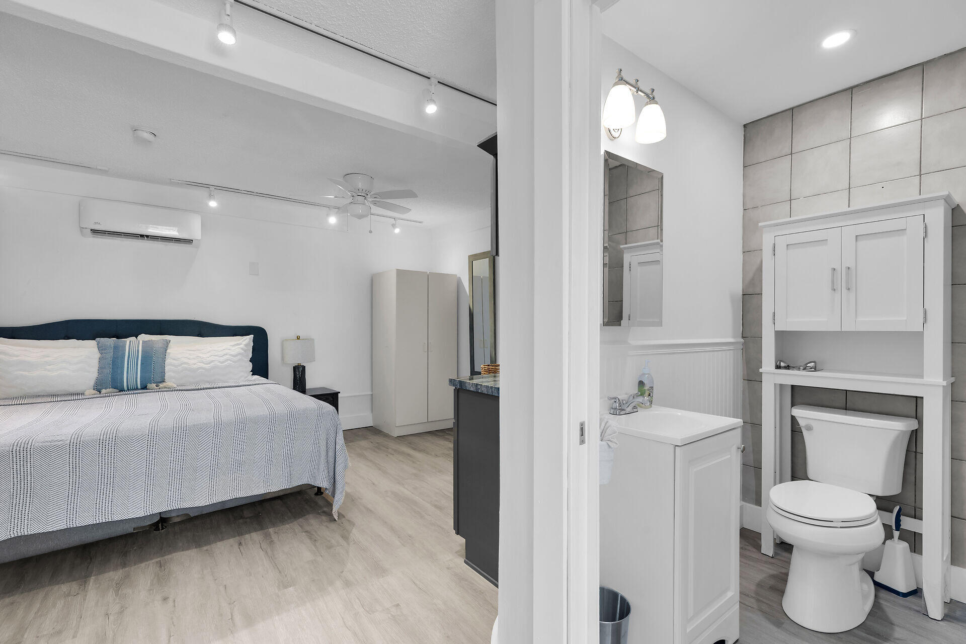 1519 Johnson Street Key West, FL 33040 - Photo 34 of 47 a spacious bedroom with a bed and a view of bathroom