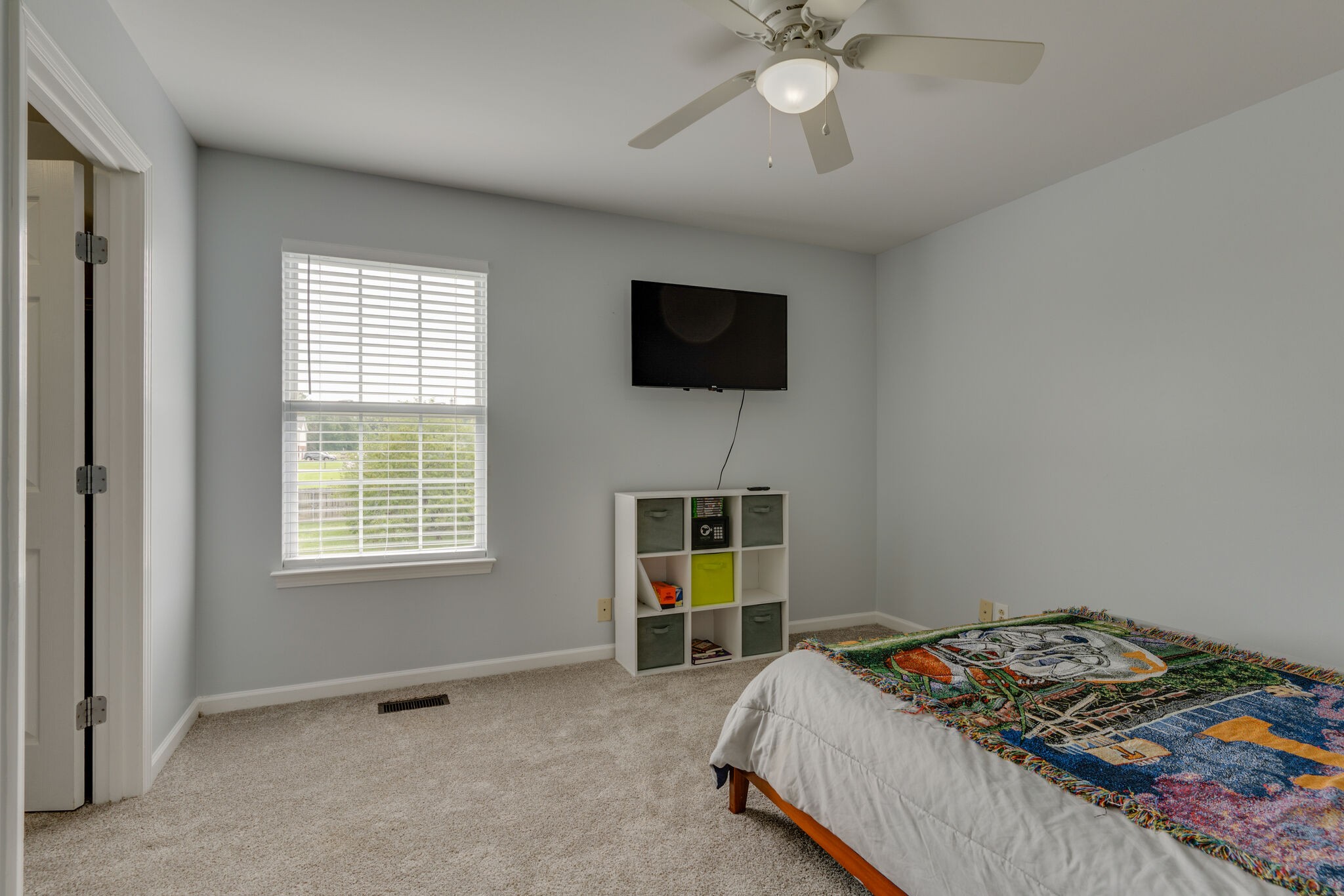 5259 East Robertson Road Cross Plains, TN 37049 - Photo 16 of 28 a bed room with a bed a television and a window