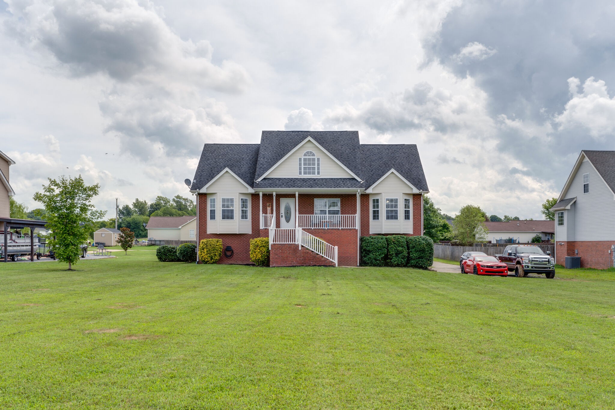 5259 East Robertson Road Cross Plains, TN 37049 - Photo 2 of 28 a view of a house with a big yard plants and large trees