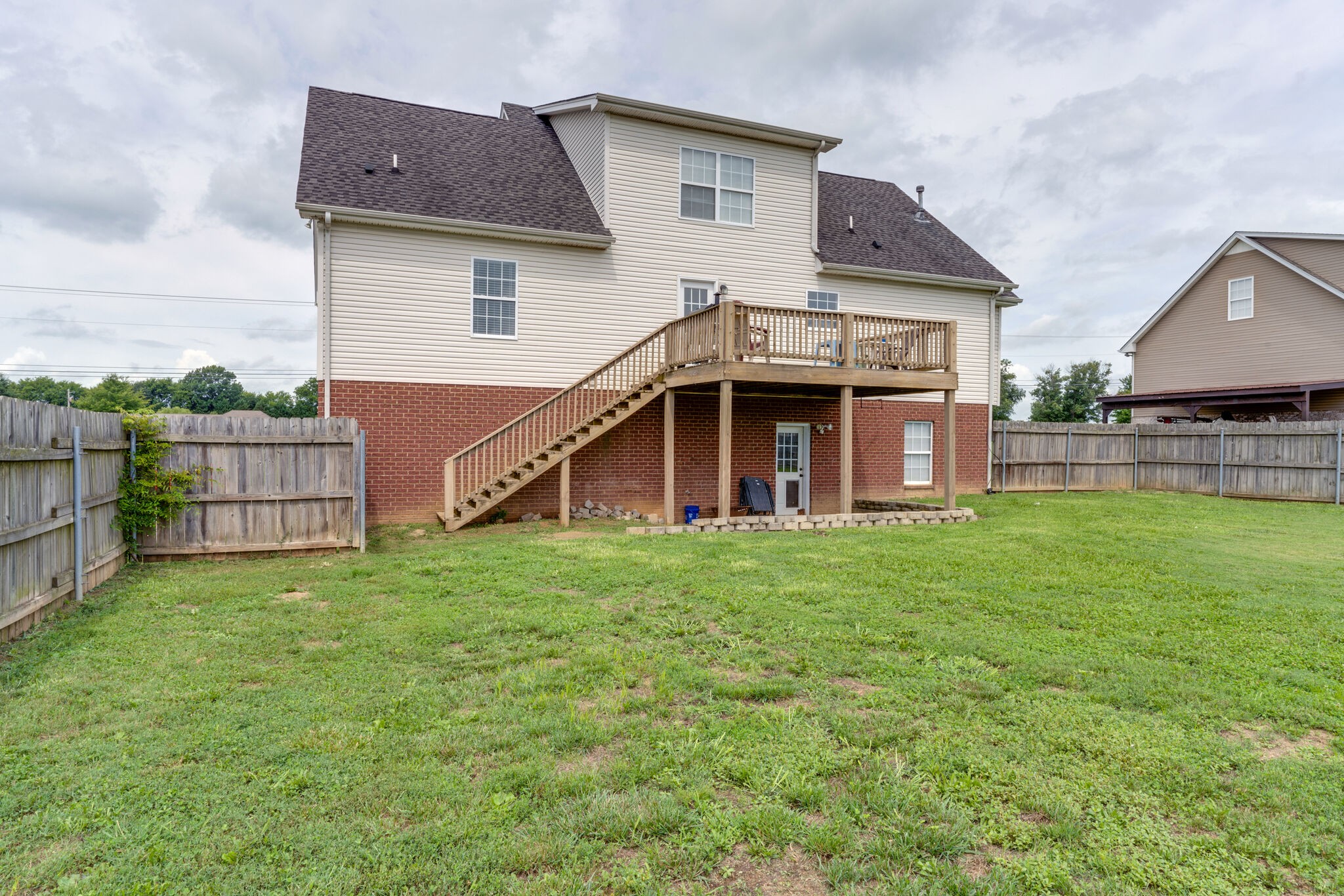 5259 East Robertson Road Cross Plains, TN 37049 - Photo 27 of 28 a view of a house with a backyard