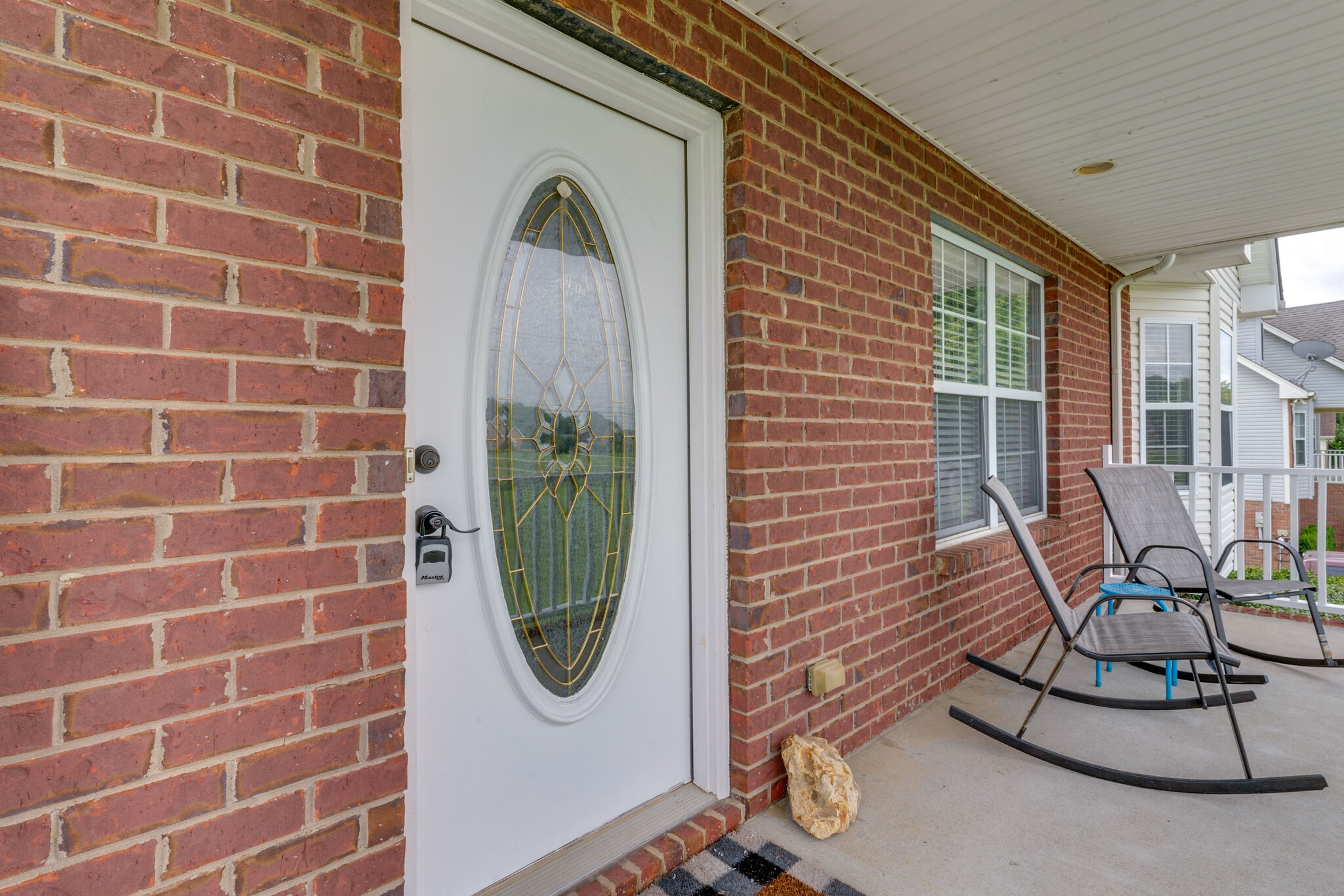 5259 East Robertson Road Cross Plains, TN 37049 - Photo 3 of 28 a view of a brick wall with a dining table and chair