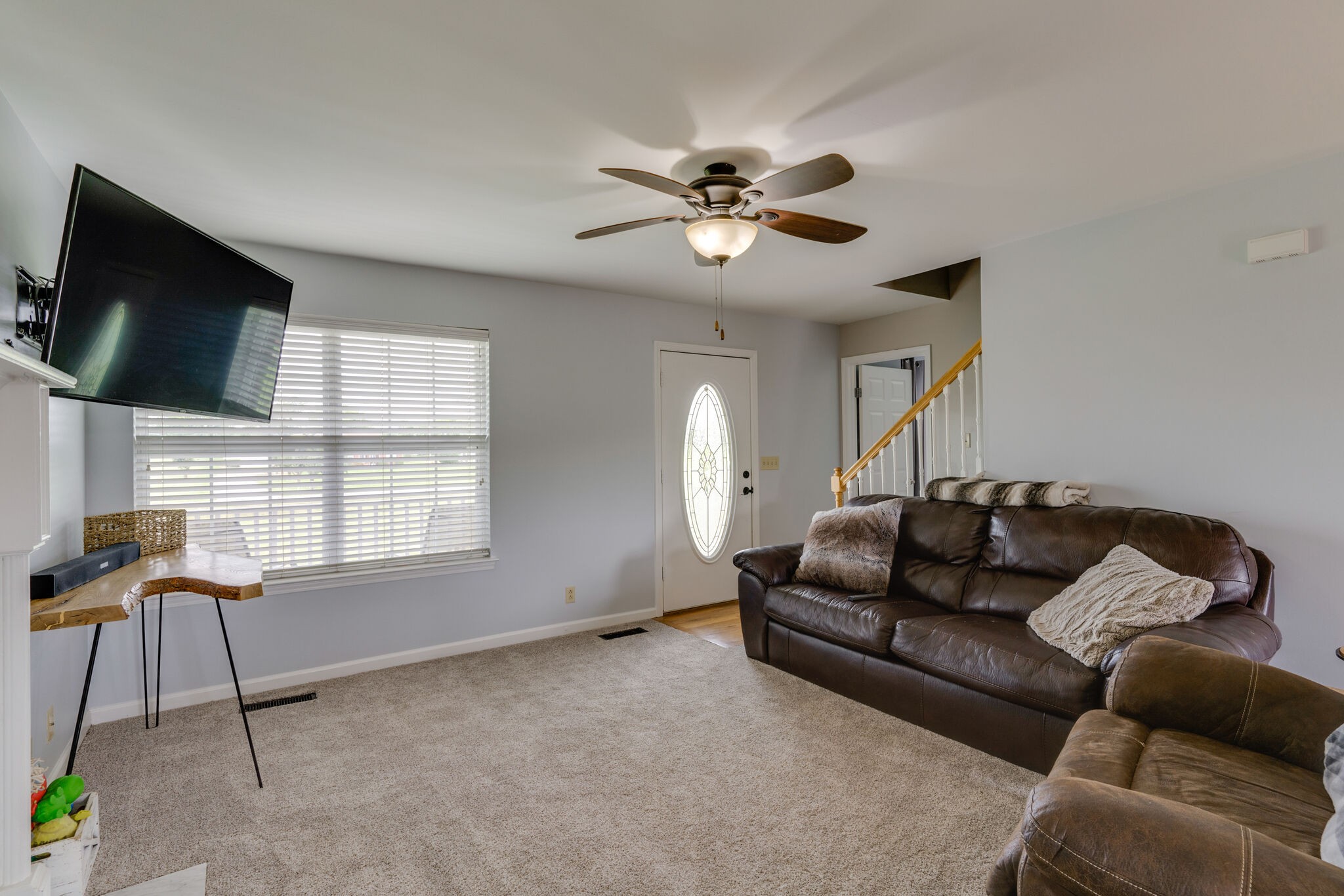 5259 East Robertson Road Cross Plains, TN 37049 - Photo 5 of 28 a living room with furniture a flat screen tv and a window