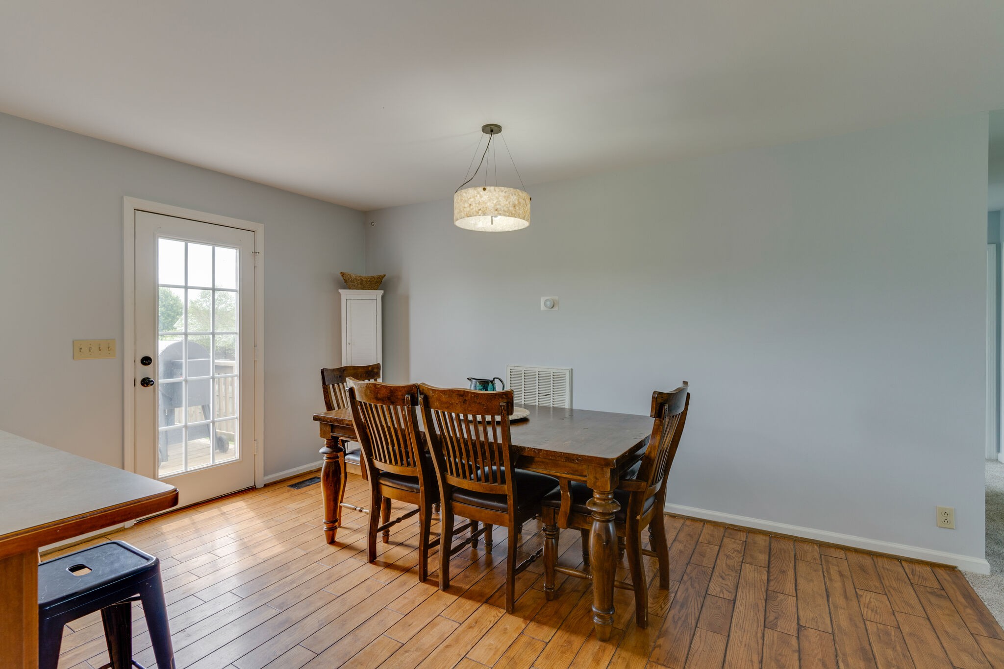 5259 East Robertson Road Cross Plains, TN 37049 - Photo 7 of 28 a view of a dining room with furniture and wooden floor