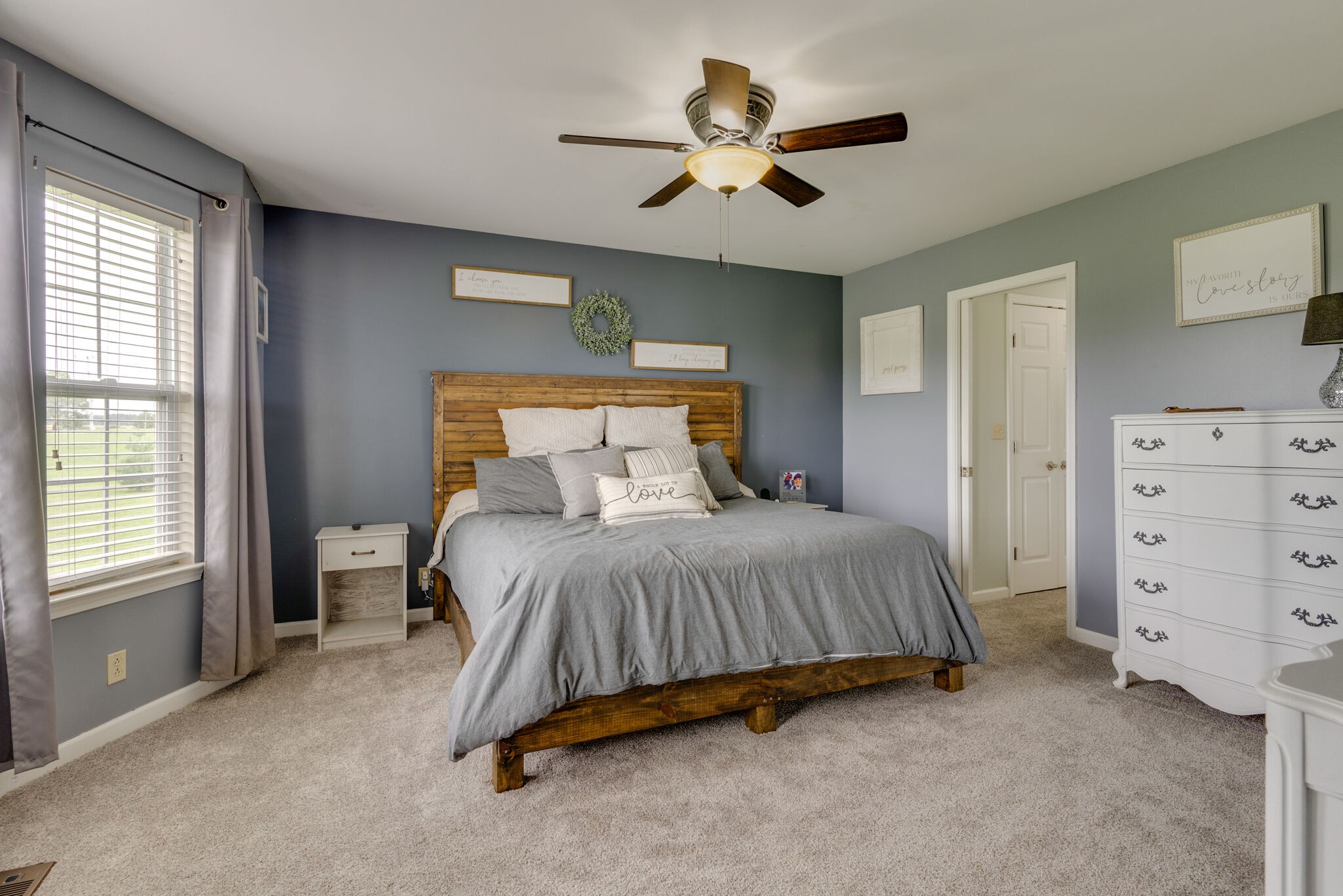 5259 East Robertson Road Cross Plains, TN 37049 - Photo 10 of 28 a bedroom with a bed and a chandelier