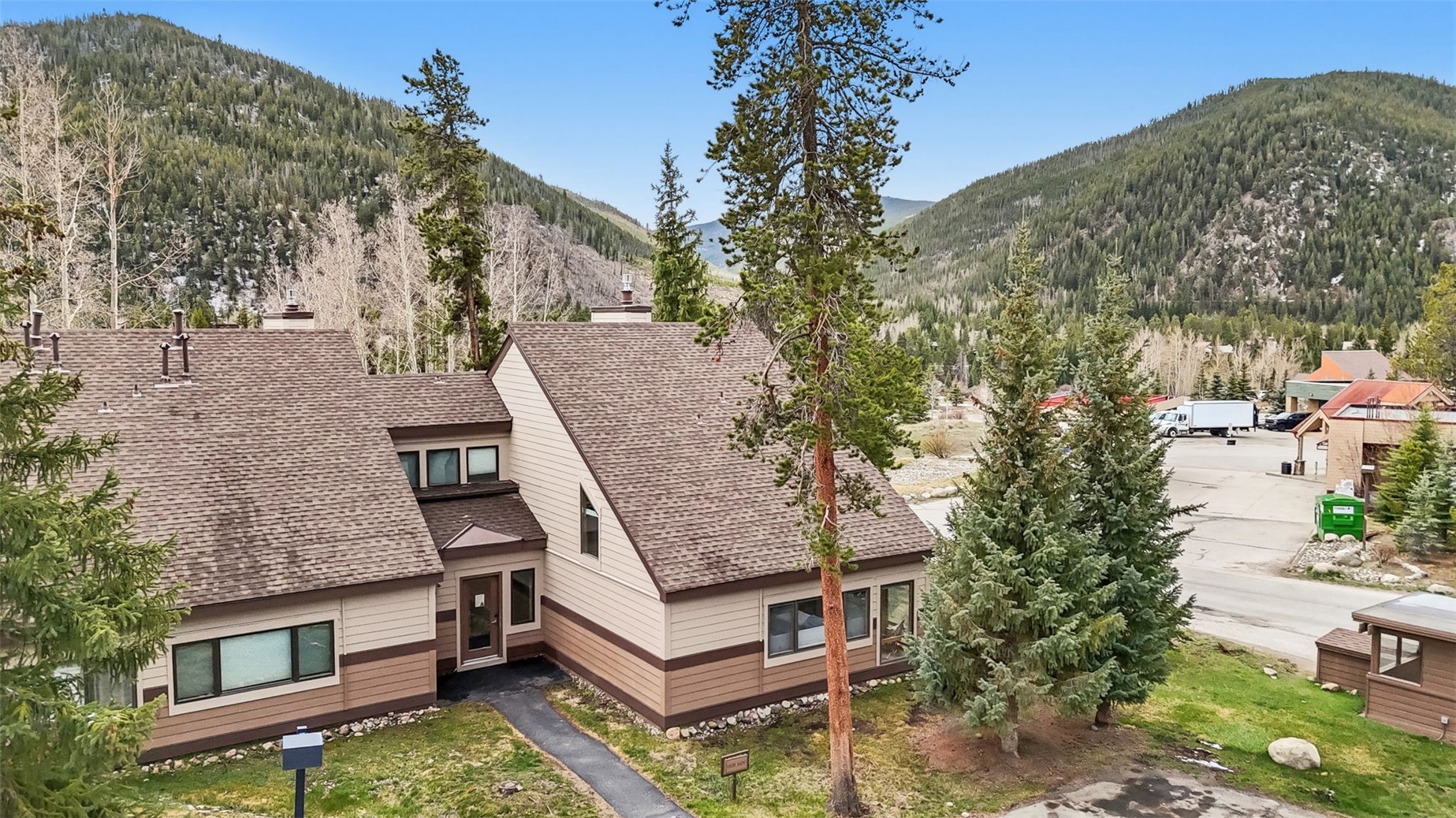 30 Tennis Club Road, Unit 1608 Keystone, CO 80435 - Photo 1 of 29 an aerial view of a house with a yard