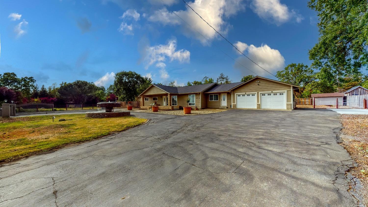 3857 Guerneville Road Santa Rosa, CA 95401 - Photo 1 of 1 a view of house with swimming pool outdoor seating and trees in the background
